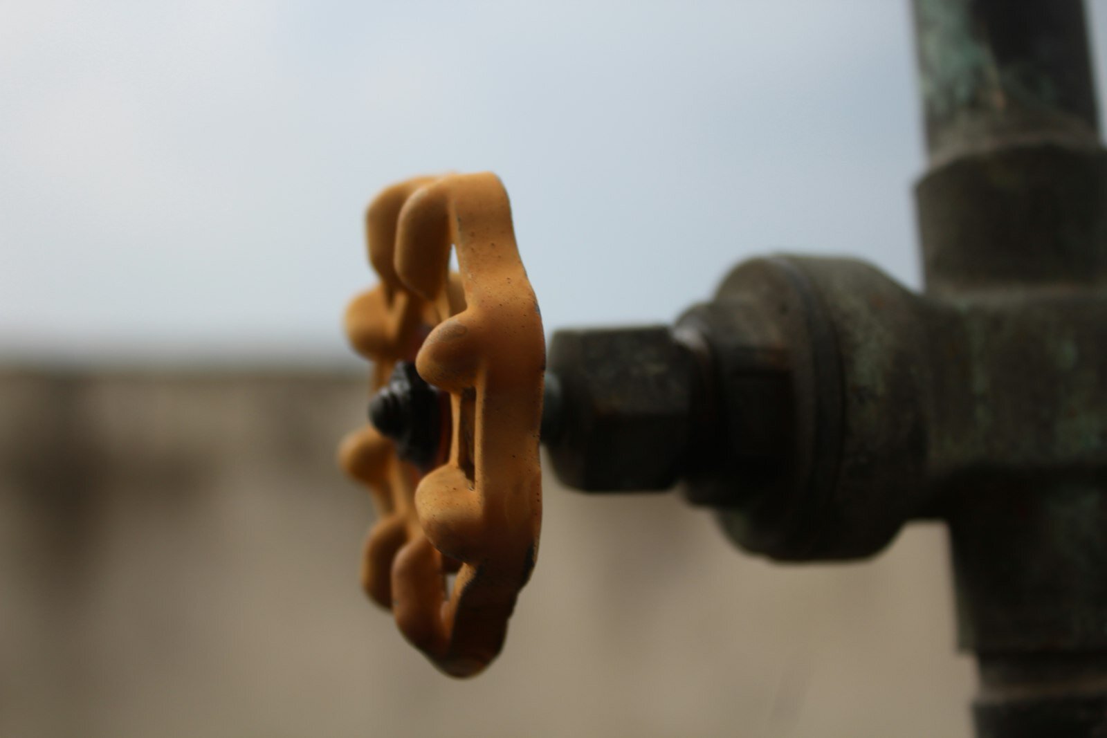 Shutting off a water valve during an attic water emergency in Phoenix
