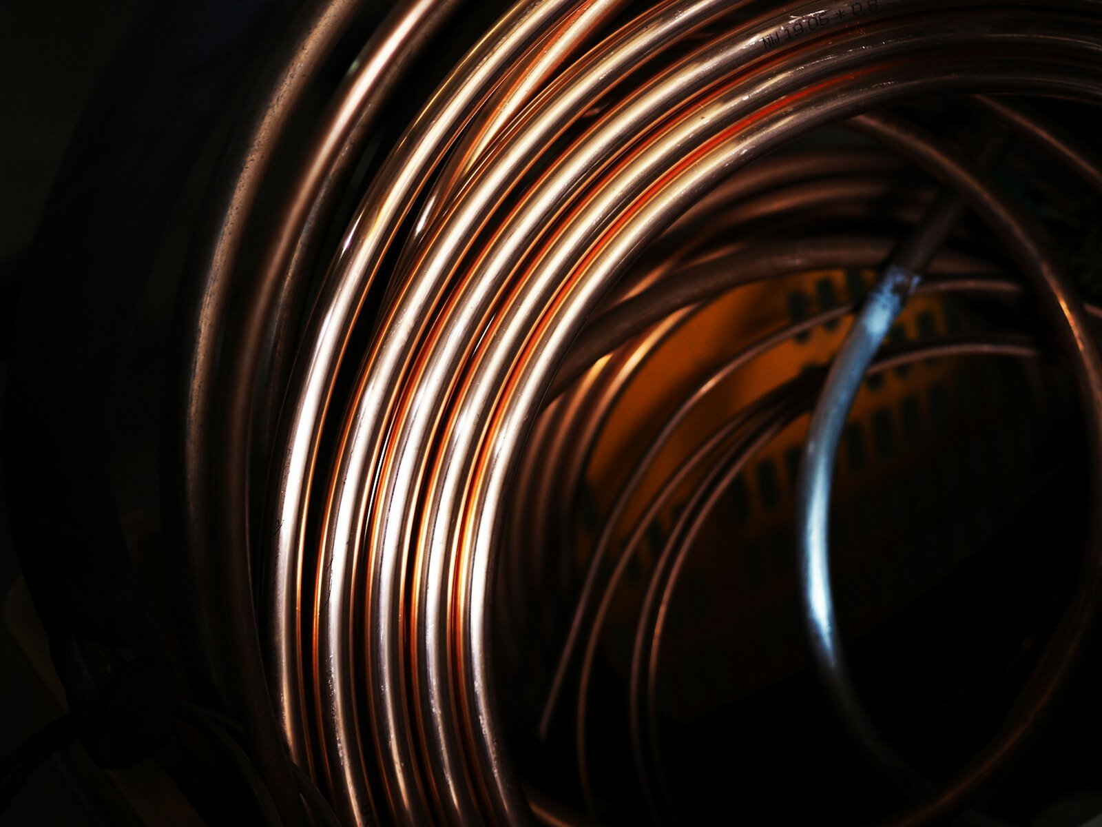 Coiled copper plumbing pipe, the kind rerouted through an attic after a Phoenix slab leak repair